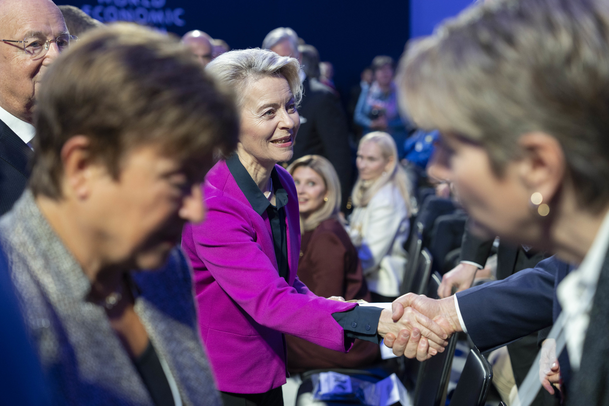 A woman shaking a hand